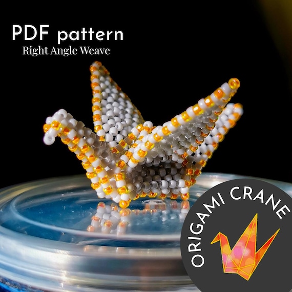 9.70 USDPattern for beaded pendant "Origami crane" PDF TUTORIALDimensions: 2.5 cm (0.98”) х 4.5 cm (1.77”) х 5 cm (1.97”) You should have experience in beading for this pattern.It contains text instructions, graphics and photos. It is necessary to know how to read the diagrams for the RAWThis tutorial is in PDF format with basic instructions in English and a detailed description of some elements.Please note: this is not a readymade pendant. Materials not included.- Toho Round beads 15/0 - Line for beading 0.15mm- Line for beading 0.3mm- Needle- Pointed tweezersYou will find your PDF file and jpg file in the section "Your purchases" in Etsy after payment.***The pattern is for personal use only. Please do not copy, resell or share.