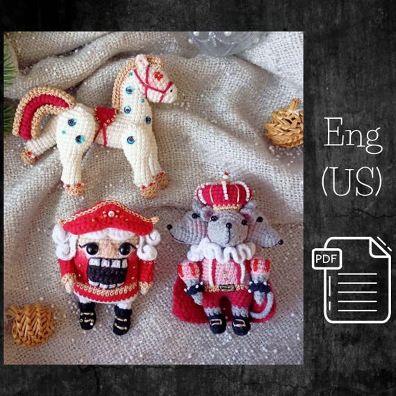 16.00 USDAccording to this pattern you will make Christmas toys based on the beloved fairytail “Nutcracker”, in the style of the Soviet cartoon. The toys turn out very festive, elegant and beautiful. And they turn out like this due to the metallic DMC floss, burgundy color and seed beads. Yes, you will have a lot of embroidery, but I hope you will enjoy this meditative activity.Due to the wide-set legs, the nutcracker can sit astride a horse.The Nutcracker, the Mouse King and the Horse have movable limbs due to the thread fastening. Also there is the description of the wig that is crocheted without breaking the thread.The toys will definitely win your heart, and will also become a wonderful Christmas gift and decoration for your Christmas tree.Give your family and friends a piece of yourself and a New Year's moodHeight of toys:Nutcracker - 10 cm, Horse - 10.5 cm, Mouse King - 11 cm.The size depends on the yarn weight, your gauge and hook size.THIS PATTERN INCLUDES:- 51 pages of detailed description- high quality photos- and video in RussianRecommended materials and tools:-Dark red and cream semi-cotton/cotton 4ply yarn. I most often use yarn from the following brands: Gazzal Baby Cotton, Yarn Art Jeans, Alize Cotton Gold.-A little gray, white, pink, black, beige or skin colors.-Metallic gold DMC embroidering floss, No. M-27 - 2 skeins.-Safety eyes 8 mm.-Black beads - 9 pcs.-Seed beads - white, red, gold, light blue, transparent gold and large white.-Nylon thread for sewing on seed beads and a needle with a thin eye.-Blue sequins.-Fiberfill.-Hook size 2 mm or 2.5 mm.-Needle for embroidery and sewing.-Hot glue gun.-Thick plastic.-Stitch marker to mark the beginning of a round, blush or dry pastel, tweezers and a stick with a rectangular tip for better distribution of fiberfill (optional).Level: intermediate.You'll download one immediately after the purchase.Pay attention! It's a digital tutorial, not a finished Nutcracker, Horse & Mouse king.As it's a digital file, no cancellation or return is possible. If you aren't satisfied with your order, please contact me and we'll find the way out.The template will be available for download immediately after the payment confirmation. You will receive an email from Etsy with a link to download the template. For more details, please visit the page https://help.etsy.com/hc/en-us/articles/115013328108If you are going to purchase this template through the Etsy mobile app.The download link will not be available to you.To get the correct link to the template.You need to log in to your ETSY account using any browser.!!! Not via the mobile app. HAVE A NICE CROCHETING!