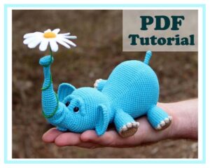 5.60 USDAmigurumi Elephant and balloon. Amigurumi Elephant and flower. Crochet pattern PDF. Tutorial.!!! Language: ONLY ENGLISH !!!Pattern Crochet PDF Tutorial - Instant downloadPDF pattern includes instructions on 17 pages, 28 photos, 16 videos. (The elephant pattern, pattern of the flower and balloon) Dimensions of my elephant: length 22 cm, height 9 cm, trunk height 14 cm.Legs, head and trunk of an elephant do not sew, they are crocheted at once.Pattern is written in English.Level: advanced beginner/intermediate.This listing is for a PDF PATTERN INSTANT DOWNLOAD, not a finished product.Materials:- YarnArt Baby, 150m/50g, 100% acrylic, 1.5 skeins of yarn. (or any other yarn made up of acrylic, acrylic/cotton)- Thin yarn for flower - white, yellow, green (I have Alize Miss)Dimensions of my elephant: length 22 cm, height 9 cm, trunk height 14 cm.If you need a smaller size, then take the yarn thinner. If you need a large size, then take the yarn thicker. - Hook 2 mm (if no other hook is specified on the label)- Eyes 10 mm- Wire (40 cm for trunk and 12 cm for flower stem)- Hollow fiber (or other stuffing material).- Cardboard.- Glue (to glue eyes).- Needle, scissors (to sew the tail)