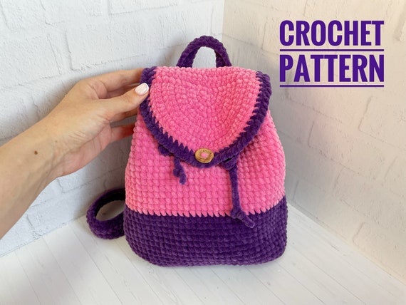 5.99 USDAny child will be happy with such a plush backpack. Crochet it as a gift to someone or for your child.This listing is an original pattern (written in English using American terminology) to crochet.The pattern does not contain a basic crochet course-you should already have basic knowledge!ATTENTION: This is a PDF template for crochet! Not a finished product!_______________________________________This crochet pattern is easy to follow with step-by-step instructions, photos illustrating the process).It does not contain crochet lessons. You should have basic crochet skills to be able to crochet with the help of this crochet pattern.*****************************************This crochet pattern is available for Instant Download. When your payment is completed you will receive an email with all the information needed to download your file. This email will be sent to the email address connected with your Etsy Account. If you have any problem, please contact me.*********************************You will need Adobe Reader to open this Pattern.This template is delivered via digital instant download.When your payment is completed, you will receive an email from Etsy with a download link.This very simple crochet pattern includes step-by-step photos that will help you along the way. Difficulty: medium. Basic crochet skills are essential for crocheting in this pattern.**************************************— The size of the backpack - 21 cm wide (8.2 ‘’), 24 cm high (9.4 ‘’).Recommended materials and toolsSuper Bulky/Super Chunky/14ply velvet yarn HIMALAYA DOLPHIN BABY – 2 skeins of different colors.Sewing needleHook size 3.75 mm by CloverWooden buttonAbbreviations: ch – chain MR – magic ring sc – single crochet inc – increasedec – decreasesl st – slip stitchBLO – back loops onlyt-ch – turning chain(….) * n – repeat instruction in brackets N times (…) – number of loops in a row / roundRecommended materials and toolsSuper Bulky/Super Chunky/14ply velvet yarn HIMALAYA DOLPHIN BABY – 2 skeins of different colors.Sewing needleHook size 3.75 mm by CloverWooden buttonAbbreviations: ch – chain MR – magic ring sc – single crochet inc – increasedec – decreasesl st – slip stitchBLO – back loops onlyt-ch – turning chain(….) * n – repeat instruction in brackets N times (…) – number of loops in a row / round