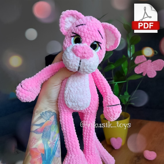 10.97 USDIn this pattern you will learn how to crochet a Pink Cat. The finished toy is ~12.9 inches / 33 cm tall using a 3.75 mm crochet hook and stated materials. 3.75 – 4 mm crochet hook for plush yarn.This pattern tutorial includes one PDF file with 25 pages of detailed descriptions of how to crochet your toy with simple step-by-step instructions (language: English and Russian) and plenty of photos.Please note: this is not a readymade toy. Materials not included. Materials:Plush yarn 120m/100g.Basic color – 100 -120g.Additional color (belly, muzzle, ears) – about 20 g.Safety eyes D=18 mm.Lighter to secure the washers.Yarn Kid’s novelty or similar yarn for the muzzle and paws design.Firm thread for sewing the parts (I use a sewing thread).Thread for sculpting (I use YarnArt Jeans).Tapestry needle (short and long).Pins.Scissors.Stitch markers.Stuffing material.Abbreviations (US):MR – magic ringsc – single crochetinc – increase – two single crochet in one stitchdec – decrease – two single crochet togetherch – chainsl st – slip stitch(…) inc – repeat increases are instructed(….) х 6 times – repeat 6 times or as instructedThis is a paid pattern! This pattern is protected by copyright, and it is Intended only for personal use. This pattern is a work of authorship of Victoria Kravchenko. It is forbidden: change the pattern in whole or partly, use the instructions for your patterns or video tutorials, full or partial reproduction and distribution, exchange or send this pattern to third parties. It is forbidden to publish this pattern in a whole or partly on the internet, on public social networks, or private pages. Feel free to contact me if you have any questions.