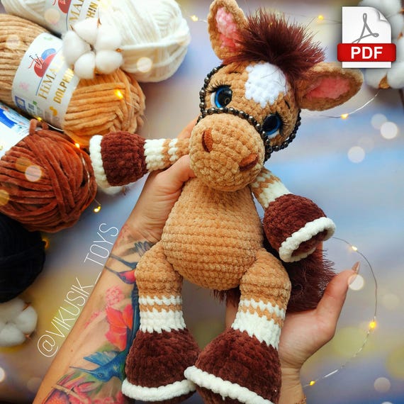 10.97 USDIn this pattern you can learn how to crochet a horse with gorgeous mane made of textured yarn or make a multi-colored curls. And if you crochet a horn you'll get a beautiful unicorn.Please note: this is not a readymade toy. Materials not included. The finished toy is ~12.5 inches / 32 cm tall using a 3.75 mm crochet hook and stated materials.I used:3.75-4 mm crochet hook.Worsted weight yarn: Himalaya Dolphin Baby 100 g of the basic color.Additional color for the hooves, ears, and spots.Yarn: Lanoso Single (similar yarn: Yarnart TANGO, or YarnArt Sambа, or Аlize decofur) for the mane and tail.Safety eyes D=18 mm.Black DK weight yarn for eyelids and eyebrows embroidery (such as kids novelty, YarnArt Jenas or similaryarn).Firm thread for sewing (I use sewing thread).Sculpting thread (I use YarnArt Jeans).Lighter.Tapestry needle (long and short).Pins.Scissors.Stitch markers.Glue and artificial eyelashes.This pattern tutorial includes one PDF file with 20 pages of detailed descriptions of how to crochet your toy with simple step-by-step instructions (language: English and Russian) and plenty of photos.Abbreviations (US):MR – magic ringsc – single crochetinc – increase – two single crochet in one stitchdec – decrease – two single crochet togetherch – chainsl st – slip stitch(…) inc – repeat increases are instructed(….) х 6 times – repeat 6 times or as instructedThis is a paid pattern!This pattern is protected by copyright, and it is Intended only for personal use. This pattern is a work of authorship of Victoria Kravchenko. It is forbidden: change the pattern in whole or partly, use the instructions for your patterns or video tutorials, full or partial reproduction and distribution, exchange or send this pattern to third parties. It is forbidden to publish this pattern in a whole or partly on the internet, on public social networks, or private pages.Feel free to contact me if you have any questions.