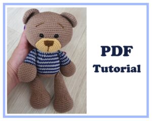 4.99 USDAmigurumi Bear Teddy crochet pattern. Crochet pattern PDF Pattern Crochet PDF Tutorial - Instant downloadPDF pattern includes instructions on 16 pages and 58 photos.Pattern is written in English.The size of the toy ≈ 24 cm.Please note: this is not a readymade toy. Materials not included.You can take any yarn you want. I'll tell you what yarn I used to crochet these Bears.Materials:- YarnArt Jeans 1 skeins of yarn, color 71. And also about 8-10 grams of yarn yellow( for muzzle) and blue, gray for sweater.(cotton - 55%, polyacrylic - 45%, 50g/160m)- Hook 2.5 mm (if no other hook is specified on the label)- Eyes 12 mm- Hollow fiber.- Needle, scissors