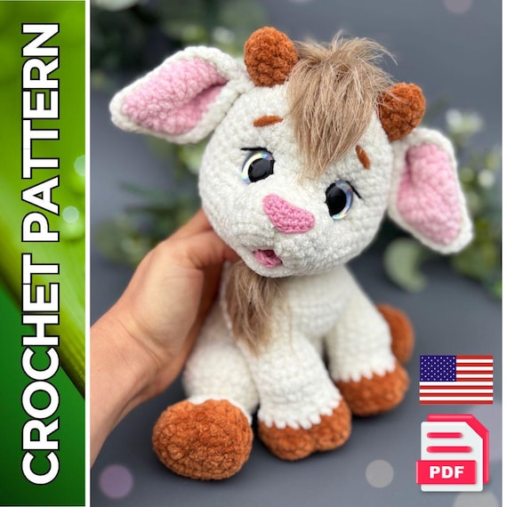 9.87 USDThis crochet pattern is a detailed PDF tutorial that will guide you through making a plush goat toy with expressive features and a movable head. The finished toy has a soft texture, a fluffy forelock and beard, and carefully shaped details. This project is suitable for intermediate crocheters who are comfortable with basic techniques and shaping. The finished piece works well as a handmade gift, nursery decor, or a collectible soft toy.The toy’s head is movable thanks to a safety joint. The legs, mouth, and ears are crocheted directly into the body, minimizing sewing. Only the horns, tail, and small decorative details are sewn on. The pattern also includes instructions for a no-sew version, where the head and body are crocheted as one piece.Please note:This is a DIGITAL DOWNLOAD (PDF pattern), not a finished toy. No physical item will be shipped.The pattern is written in English using standard crochet terminology.This pattern is created by a human designer and is not AI-generated.All photos show real handmade toys made from this pattern.What’s included:- 68 pages of detailed, step-by-step written instructions- Over 180 high-quality process photos- 13 video links for more complex steps- Instructions for assembling the toy, including head joint constructionThe pattern explains how to crochet the toy with integrated legs, mouth, and ears, while horns, tail, and decorative elements are sewn on.Finished size:The finished toy measures approximately 9–9.8 inches (22–25 cm) including the horns.Size may vary depending on yarn choice, hook size, and individual crochet tension.Materials and tools:- Plush yarn (approx. 120 m / 100 g)Main color: 120–130 gContrast colors: approx. 30 g (hooves and horns) and 10 g (inner ears)Small amount of smooth yarn (approx. 160 m / 50 g) for eyes, nose, and tongueA small amount of textured yarn for the forelock and beard- Crochet hook 4 mm and 2.5 mm (for small details)- Safety eyes (approx. 20 mm)- Fiberfill stuffing- Strong thread for sculpting- Split pin joint (2.5 × 28 mm) with discs (40 mm) and pliers- Scissors, tapestry needle, pins, and stitch markerYou can use alternative yarns and tools, but the final look and size of the toy may differ.