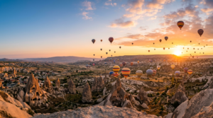 Cappadocia sunrise, many hot air balloons flying over
