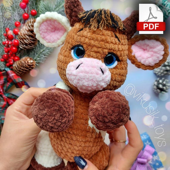 10.97 USDCrochet bull pattern, toy pattern for kids, crochet tutorial in PDF format.Language: English and Russian.Please note: this is not a readymade toy. Materials not included. Materials used:Yarn usage and height of this toy depends on your crocheting density, yarn batch, yarn brand and number of your crochet hook I used safety eyes 16mm in color dark blueYarn i used:Cow number one:Main color (100-150g.) YarnArt Dolce - №754 (gray brown).Horns, hooves (35-40g.) - Himalaya Dolphin Baby - №337(brown).Mouth, inner part of the ear (5g.) - Himalaya Dolphin Baby - №333(light peach).Cow number two - body with splashes of color and different legs.Body (100g.) - Himalaya Dolphin Baby №337 (brown).Accent body color (30-40g.) - Himalaya Dolphin Baby №333(ligh peach).Mouth, inner part of the ear (5g.) - Himalaya Dolphin Baby №303(powder pink).Horns, hooves (35-40g.) - YarnArt Dolce - №754(gray brown).Alternative colors:I suggest brown hooves, №339 or №322.For mouth and inner part of the ear:Himalaya Dolphin Baby - YarnArt DolceColor №303 (powder-pink). or №750(light pink).For horns and hooves:Himalaya Dolphin Baby №343(brown)Body ideas:YarnArt DolceColor №757(mustard)Color №765(brown)Color №747(beige)Himalaya Dolphin BabyColor №330(mustard)Color №337(brown)Color №317(beige)Colors are displayed as an example, I suggest you to look to yarn shops where you can find for example milky tones and other interesting colors. You also need little bit of white plush yarn for sewing the white parts of the eye. Little bit of thin black and brown yarn for hair, eyebrows and tail. Yarn for sewing parts together. Abbreviations (US):MR – magic ringsc – single crochetinc – increase – two single crochet in one stitchdec – decrease – two single crochet togetherch – chainsl st – slip stitch(…) inc – repeat increases are instructed(….) х 6 times – repeat 6 times or as instructed This is a paid pattern!This pattern is protected by copyright, and it is Intended only for personal use. This pattern is a work of authorship of victoria kravchenko. It is forbidden: change the pattern in whole or partly, use the instructions for your patterns or video tutorials, full or partial reproduction and distribution, exchange or send this pattern to third parties. It is forbidden to publish this pattern in a whole or partly on the internet, on public social networks, or private pages. Feel free to contact me if you have any questions.