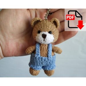 6.00 USDPattern updated June 23, 2024. Translation errors and typos have been corrected.Key Ring Bear pattern contains 9 pages. You will make a cute bear with your own hands. The toy is knitted. English language.Materials and tools needed:- yarn for the bear: brown and a little white; I used Alize Merino Royal Fine (100% wool, 50 g/175 m). The thinner the yarn is, the smaller the bear will be;- yarn for the overall;- knitting needles of corresponding size. I used 1.5 mm and 2 mm;- crochet hook 2 mm;- eyes or beads ~ 4 mm in diameter; - synthetic fiberfill;- key ring.Please note: this is not a readymade toy. Materials not included.