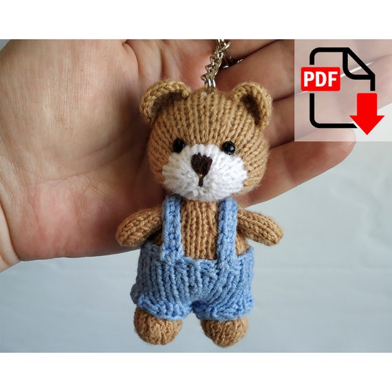 6.00 USDPattern updated June 23, 2024. Translation errors and typos have been corrected.Key Ring Bear pattern contains 9 pages. You will make a cute bear with your own hands. The toy is knitted. English language.Materials and tools needed:- yarn for the bear: brown and a little white; I used Alize Merino Royal Fine (100% wool, 50 g/175 m). The thinner the yarn is, the smaller the bear will be;- yarn for the overall;- knitting needles of corresponding size. I used 1.5 mm and 2 mm;- crochet hook 2 mm;- eyes or beads ~ 4 mm in diameter; - synthetic fiberfill;- key ring.Please note: this is not a readymade toy. Materials not included.