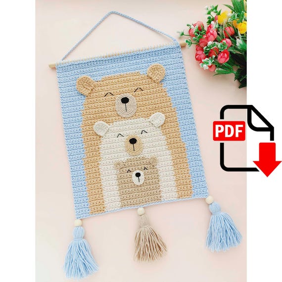 6.20 USDCreate your own crochet wall hanging decor with this crochet pattern! This easy-to-follow pattern includes 1 PDF file with detailed instructions and Graphical Scheme. It will be wonderful wall decor for your home or as a baby shower gift.Only basic crocheting skills will be needed: chain, single crochet, slip stitch, double crochet, increasing, decreasing.I’m sure that you love this sweet bears family! You can always ask me if you have any questions.This pattern is in English language.Please note that this is a crochet pattern (PDF file), not the toy. Materials not included. The file will be available for download immediately after purchase. MATERIALS:Yarn Art Jeans Plus – 07 (beige)Yarn Art Jeans Plus – 03 (milk)Yarn Art Jeans Plus – 75 (blue)Alize Cotton Gold Plus – 262 (dark beige)Yarn Art Jeans – 05 (milk)Yarn Art Jeans – 07 (beige)Yarn Art Jeans – 87 (dark beige)Yarn Art “Iris” - 935 (black) (for eyes and noses)Wooden or plastic stick — 30 cmHook – 3.00mmWooden beads – 3itemsAlso you need: scissors, needle with big eye.SIZE: 28х56cmPlease do not copy or redistribute this pattern or claim it as your own. You may sell your finished items if you like. Thank you for visiting my shop!