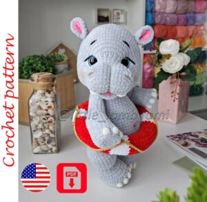 12.20 USDCrochet pattern for a plush hippo with a colorful lifebuoy. This PDF tutorial will help you make a soft amigurumi toy with sweet embroidered details, chunky proportions, and a playful summer look. The pattern is suitable for intermediate crocheters and makes a wonderful nursery decoration, baby shower gift, or handmade toy for any hippo lover.Please read before purchasing:* Digital PDF download only - no physical item will be shipped.* Pattern language: English.* This pattern is written by a human designer and is not AI-generated.* All photos in this listing show real toys crocheted from this pattern.What's included:* PDF crochet pattern.* Step-by-step written instructions in English.* Detailed assembly and finishing guidance for the hippo and lifebuoy.Finished size:Using the recommended Himalaya Dolphin Baby yarn, the finished hippo measures approximately 13.4 in (34 cm) tall.Using Himalaya Dolphin Fine yarn, the finished hippo measures approximately 11 in (28 cm) tall.The final size may vary depending on your yarn choice, hook size, and individual crochet tension.Materials and tools:- For the larger version:* Himalaya Dolphin Baby yarn (120 m / 100 g) – approximately 2 skeins of the main color, plus small amounts of white, pink, and a contrasting color for details.* Yarn for facial embroidery.* 3.5 mm crochet hook.* 20 mm safety eyes.* Fiberfill stuffing.* Tapestry needle.* Stitch marker.* Scissors.* Cotter pins and discs for movable head and legs.* Cardboard for structural support.* Dry pastel and a small brush for shading.* Glue gun.- For the smaller version:* Himalaya Dolphin Fine yarn.* 3 mm crochet hook.* 18 mm safety eyes.* Fiberfill stuffing.* Cotter pins and discs for movable head and legs.This crochet pattern creates a standing plush hippo with a removable lifebuoy, making it a fun summer-themed project for your handmade toy collection. The finished toy looks beautiful in soft pastel colors, but you can easily customize it with your favorite yarn shades.